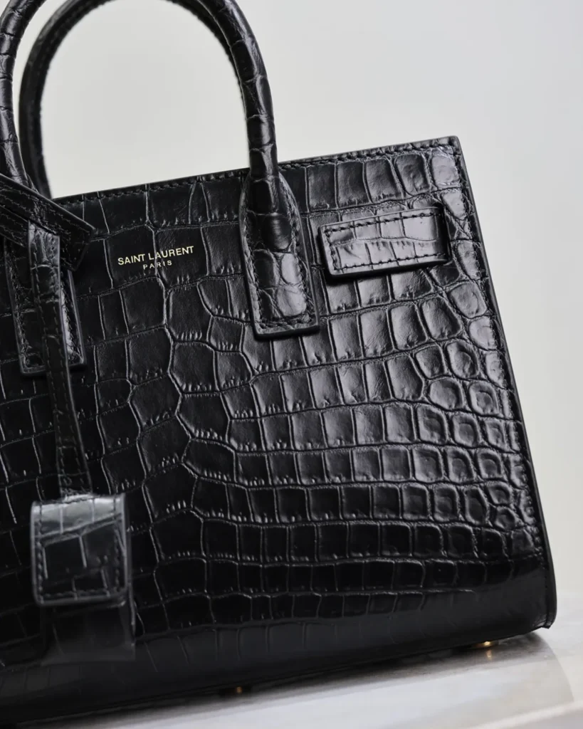 Black Embossed Accordion Tote — front detail view
