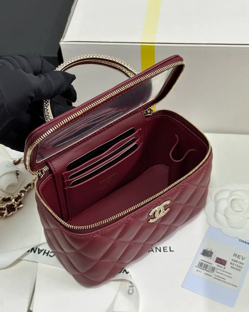 Burgundy Quilted Ornamental-Handle Vanity Bag — open interior view