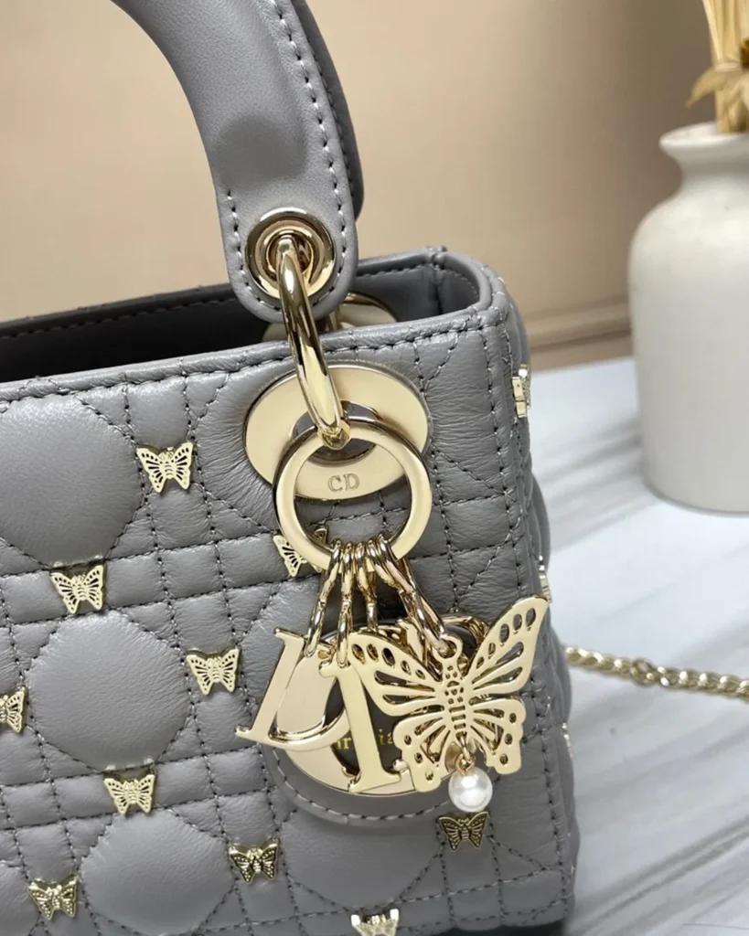 Gray Butterfly Stud Quilted Top Handle Bag — charms view