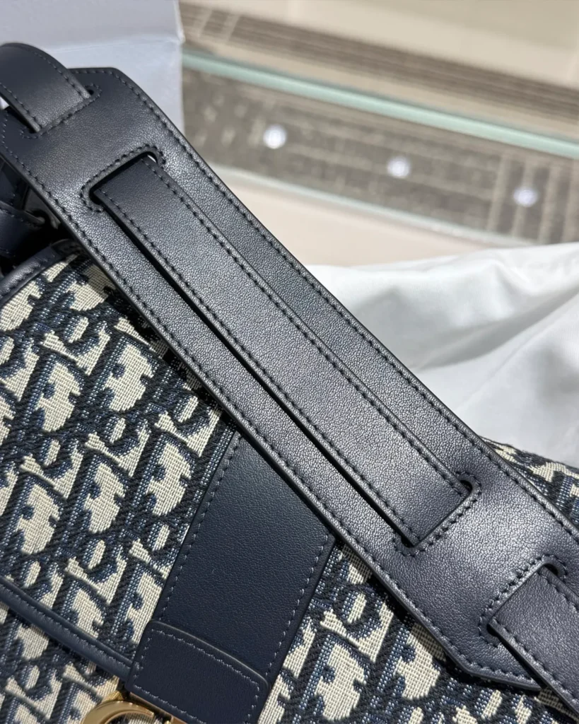 Navy Monogram Saddle Shoulder Bag — strap detail view