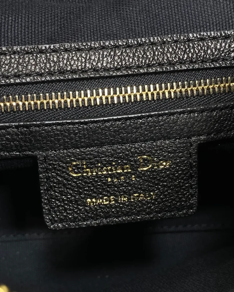 Black Soft Shoulder Bag with Letter Charms — interior zipper view