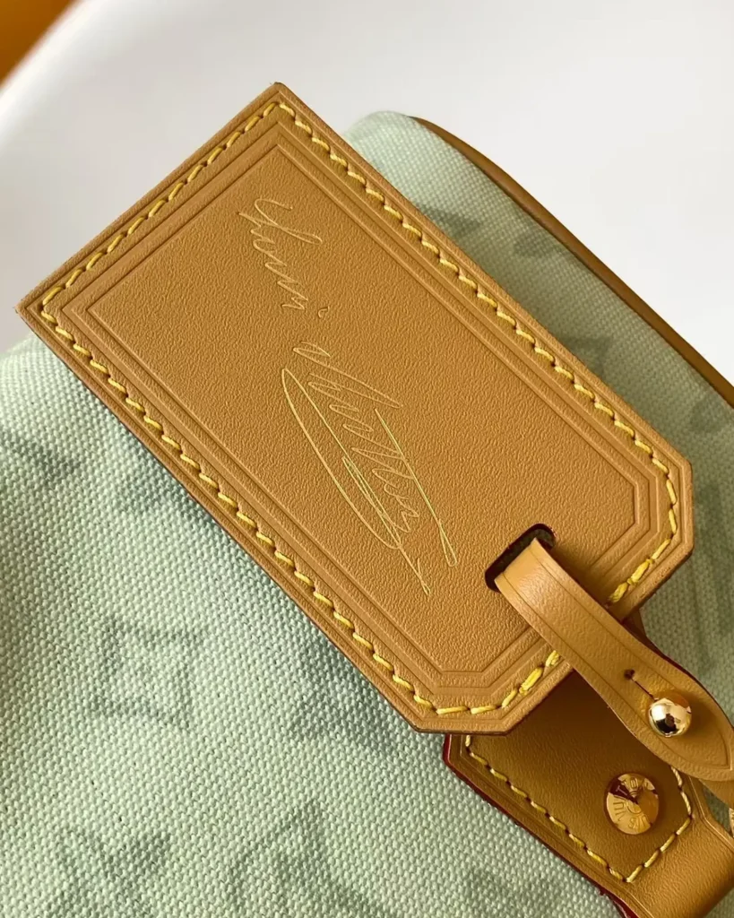 Pale Green Monogram Boston Bag — tag detail view