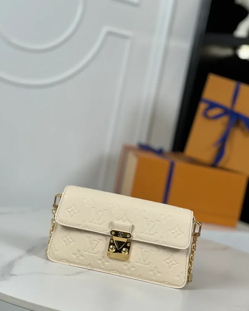 Cream Embossed Flap Chain Wallet — front view