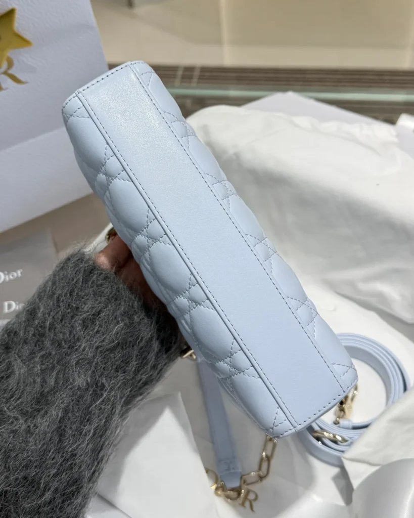 Pale Blue Horizontal Quilted Top Handle Bag — base view