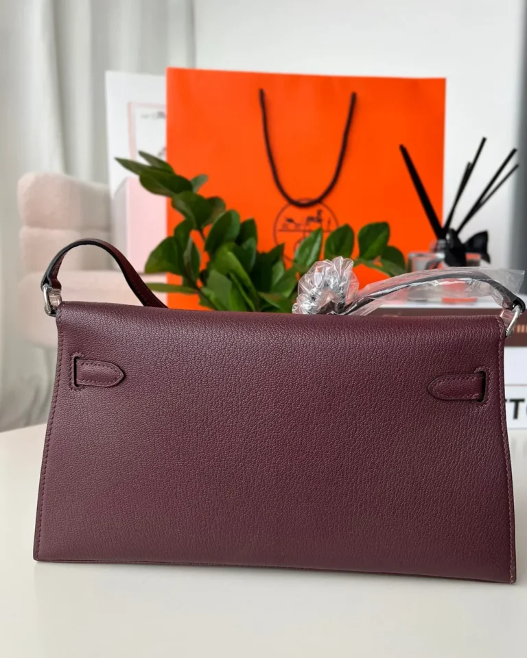 Burgundy structured shoulder bag, back view