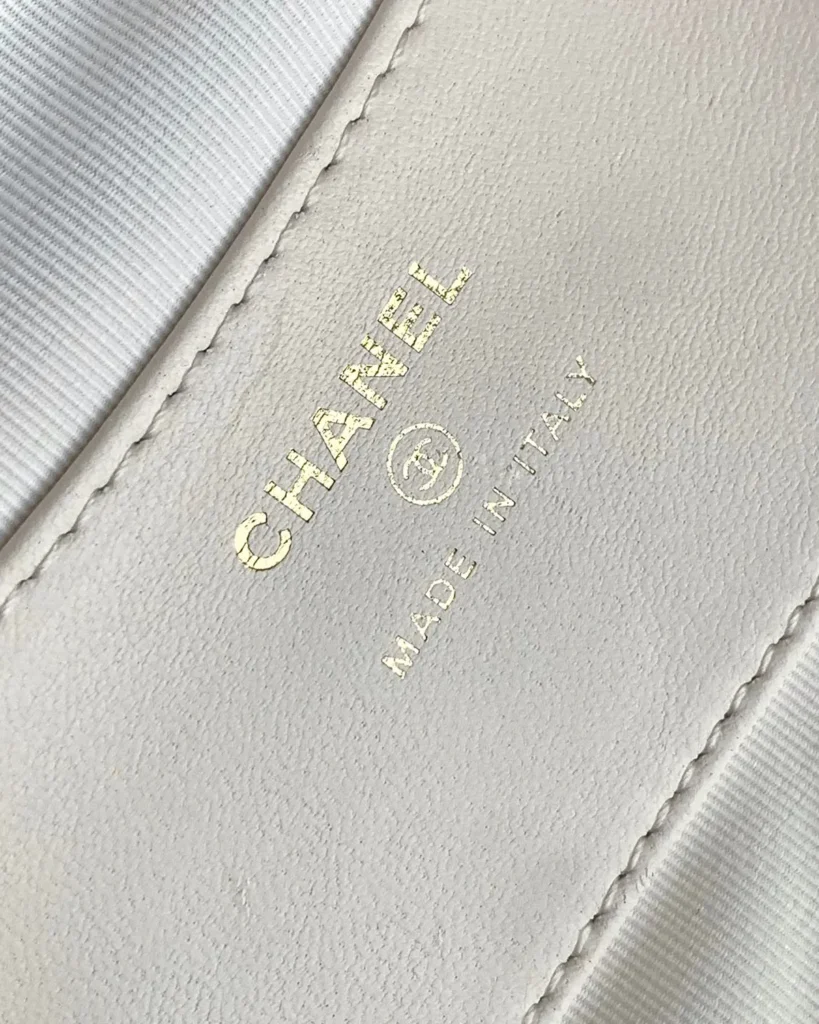 Ivory Quilted Round Chain-Edge Bag — interior label view
