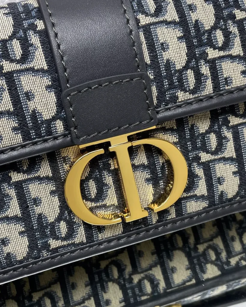 Navy Monogram Gold-Tone Chain Bag — clasp detail view
