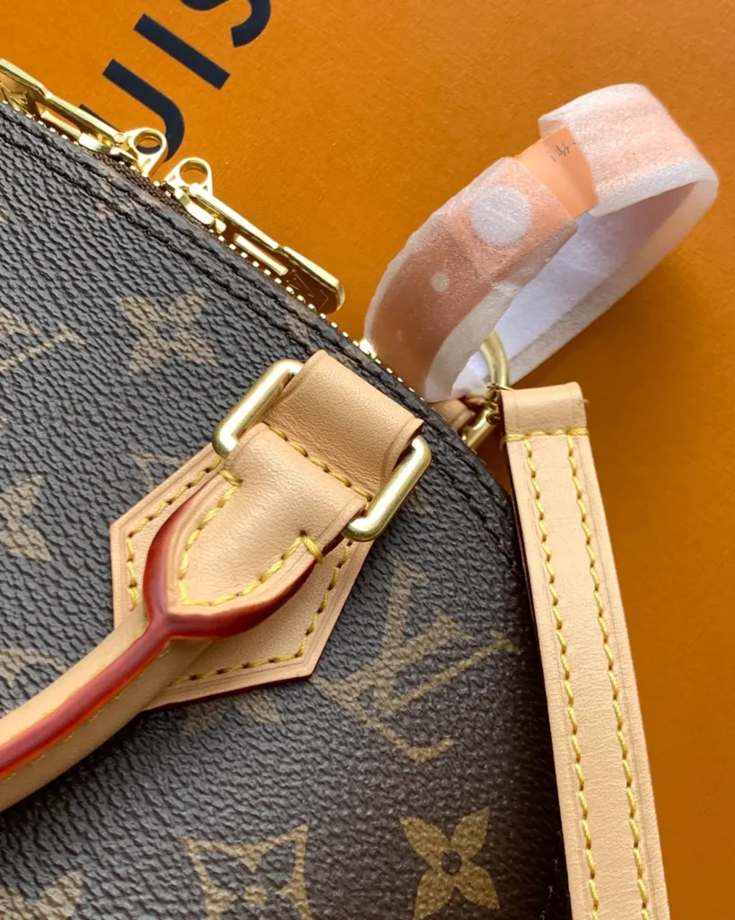 Brown Monogram Dome Satchel with Pale Trim — strap attachment view
