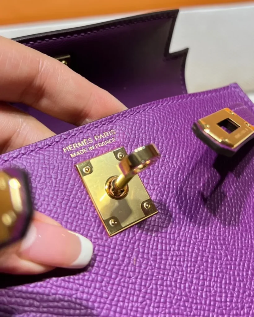 Kelly-Inspired Mini Anemone Purple Top-Handle Bag, turn-lock close-up