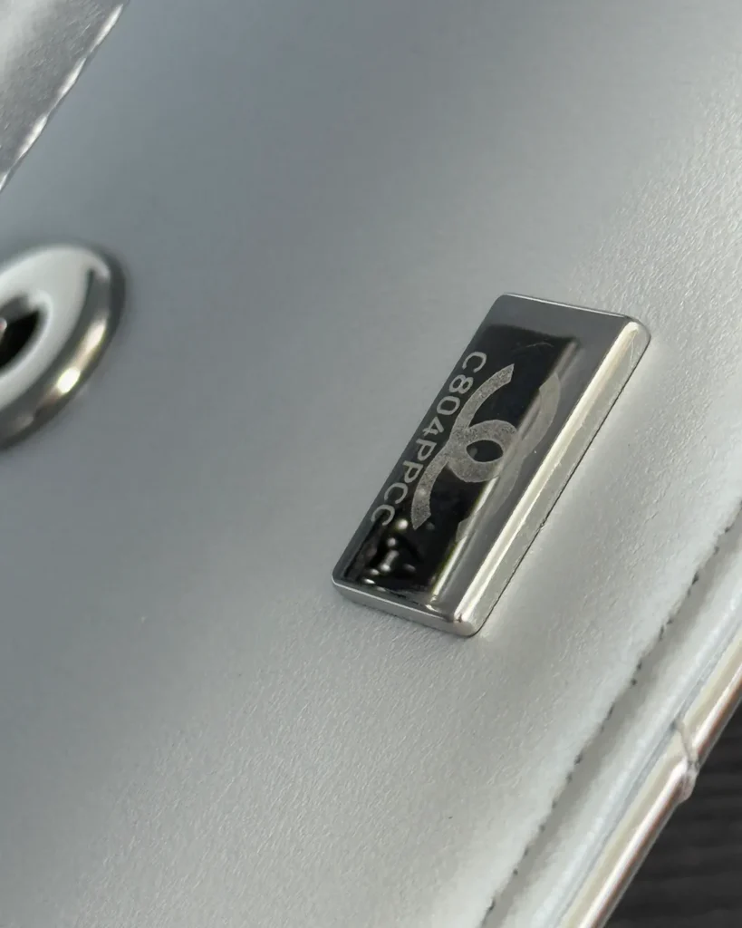 Metallic Silver Quilted Top-Handle Flap Bag — lining detail view