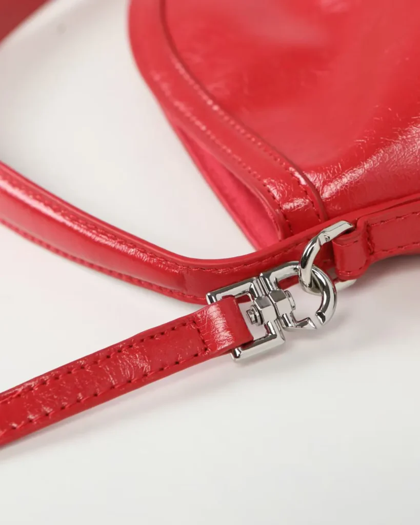 Glossy Red Buckle Shoulder Bag — strap hardware