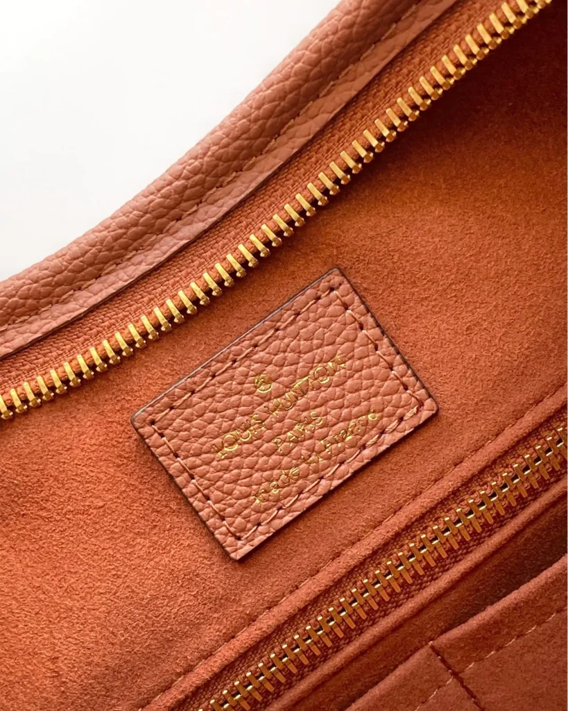 Cognac Embossed Monogram Shoulder Bag — interior label view
