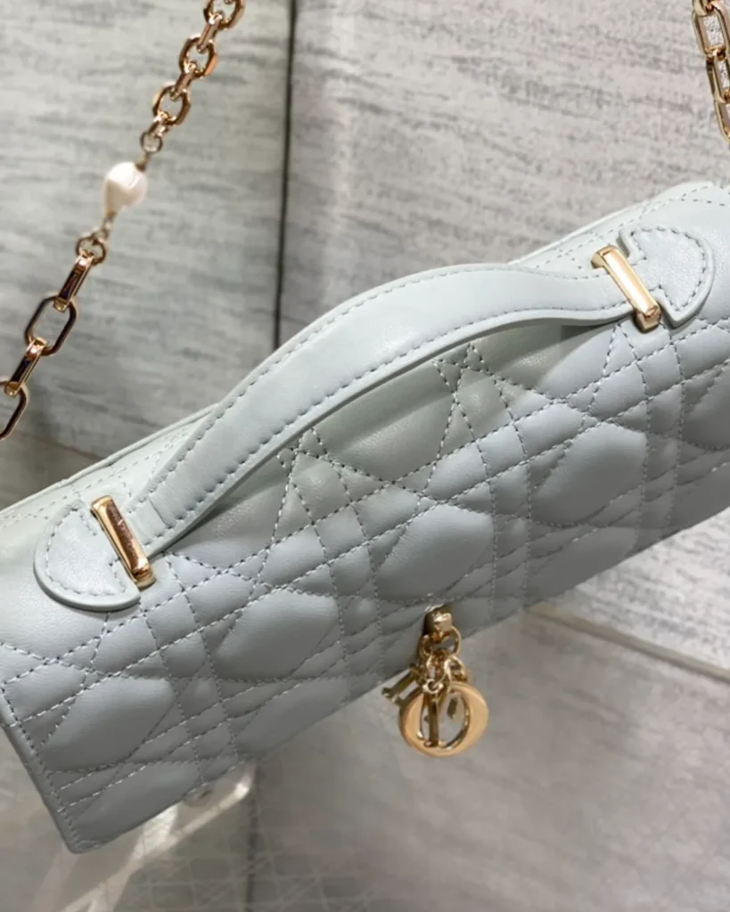 Pale Blue-Gray Quilted Top Handle Flap Bag — handle detail view