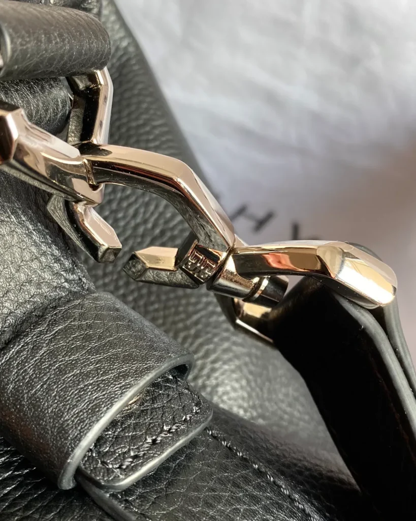 Black Rounded Twin-Handle Satchel — strap hardware