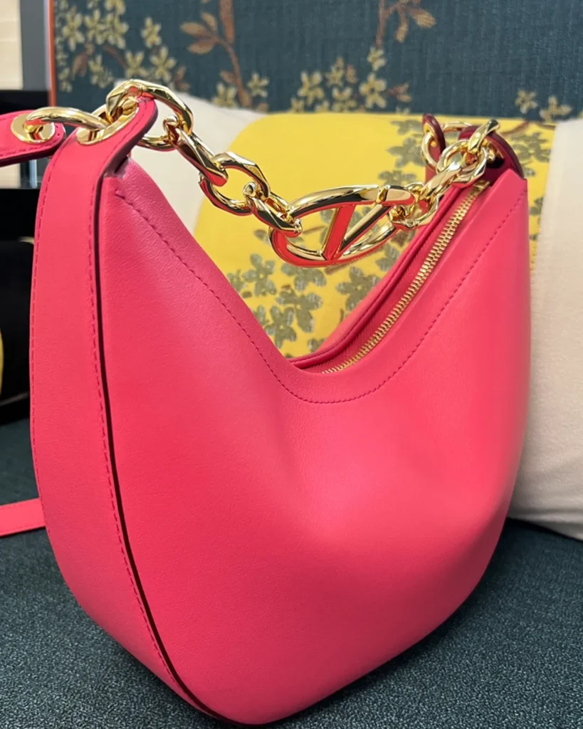 Bright Pink Crescent Chain Shoulder Bag — angled front view