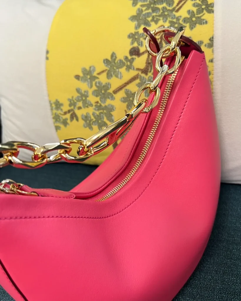 Bright Pink Crescent Chain Shoulder Bag — zipper detail view