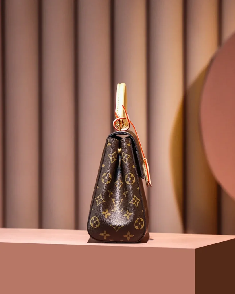 Brown Monogram Structured Top-Handle Bag — side profile view