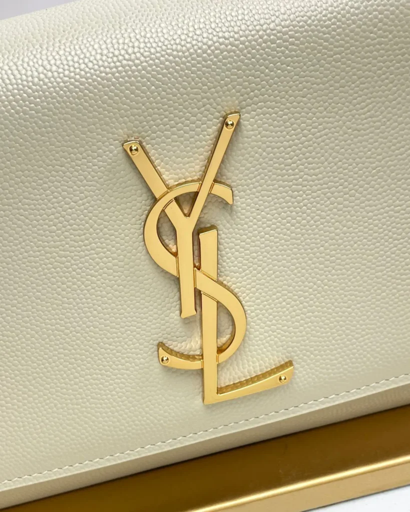 Cream Rectangular Chain Flap Bag — logo detail view