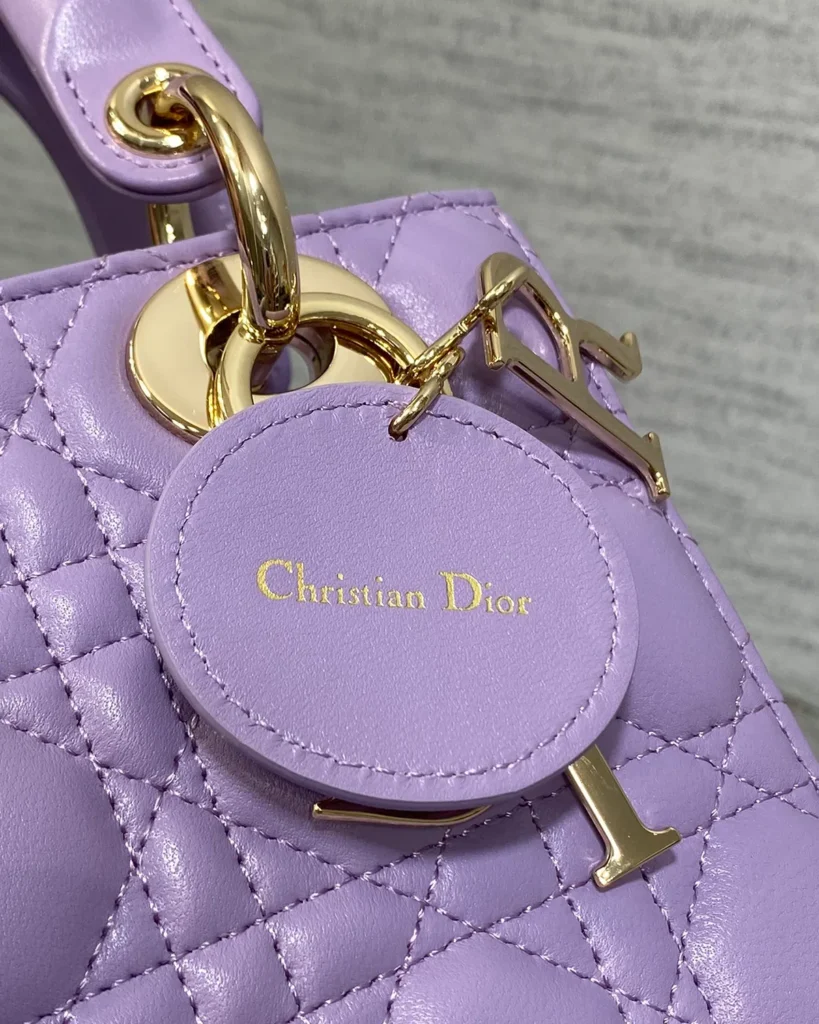 Lilac Quilted Top Handle Bag — tag detail view