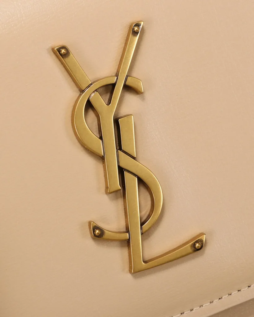 Beige Accordion Chain Flap Bag — logo detail view