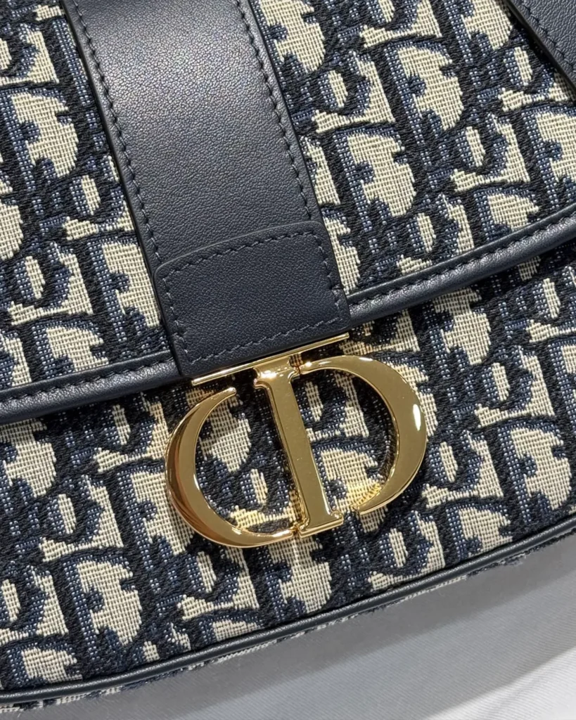 Navy Monogram Saddle Shoulder Bag — clasp detail view