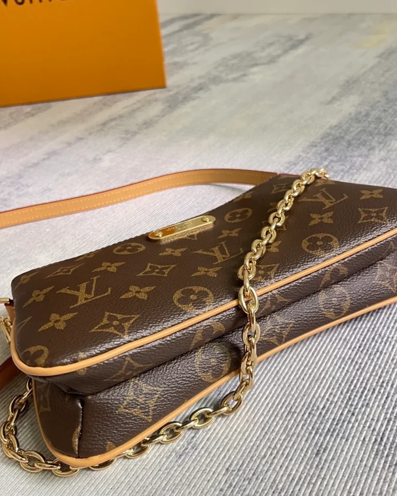 Brown Monogram Curved Zip Chain Pouch — base view