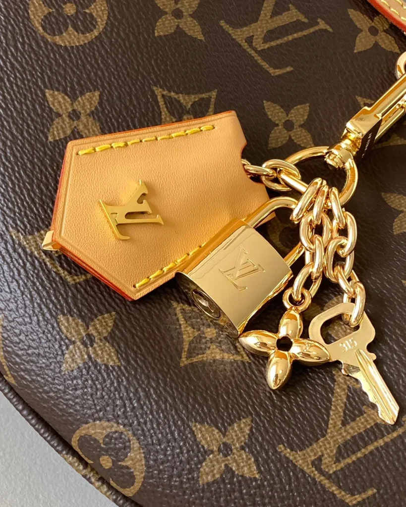 Brown Monogram Crescent Shoulder Bag — keys detail view