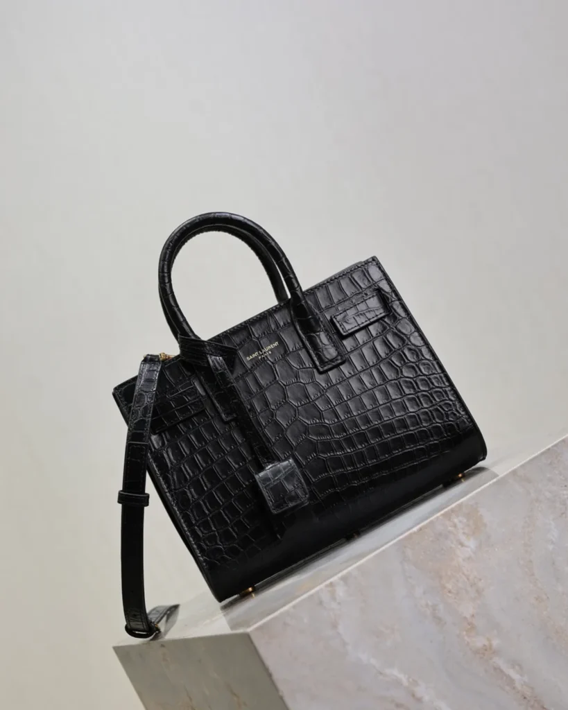 Black Embossed Accordion Tote — angled front view