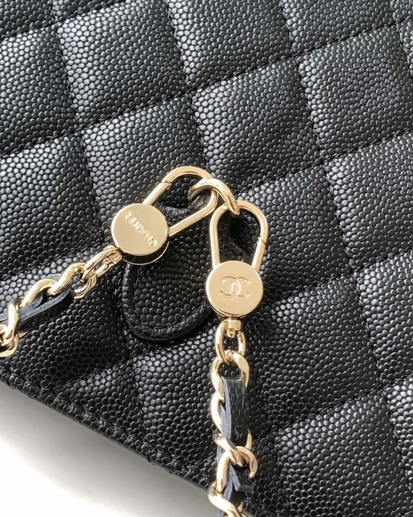 Black Quilted Top-Handle Chain Clutch — chain clips view