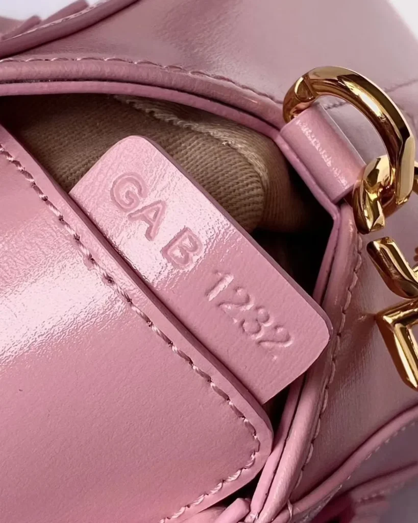 Pink Elongated Padlock Satchel — tag detail
