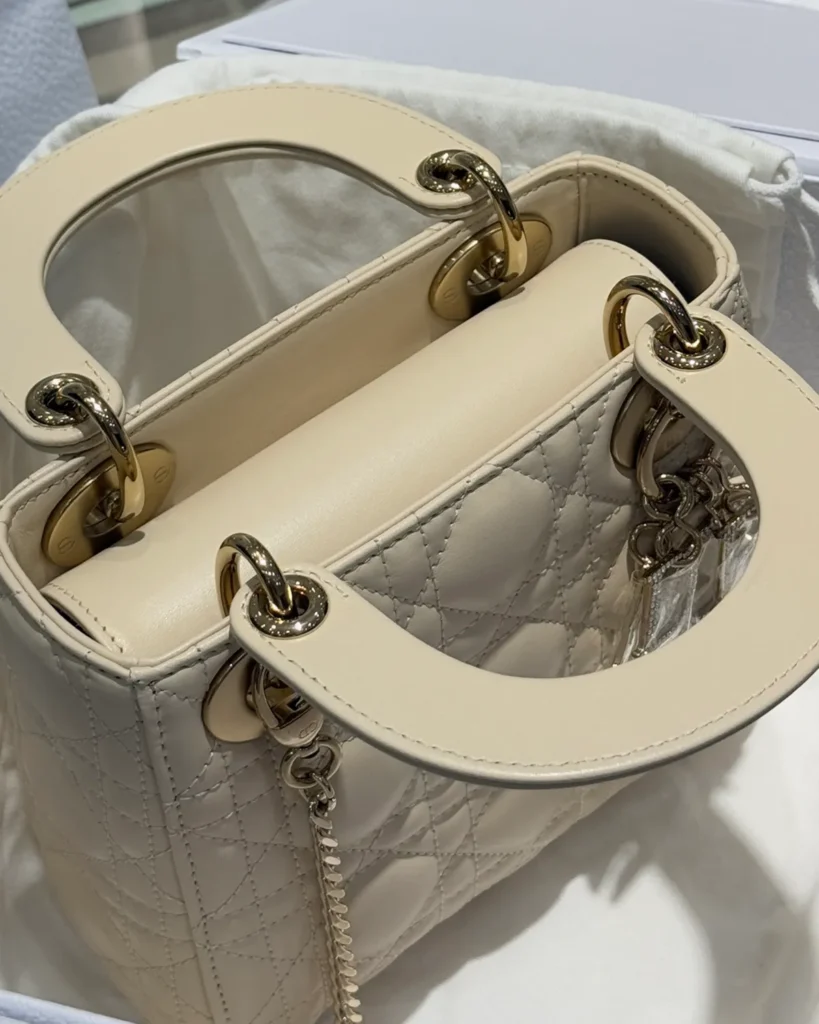 Cream Quilted Top Handle Bag with Sparkling Charms — top view
