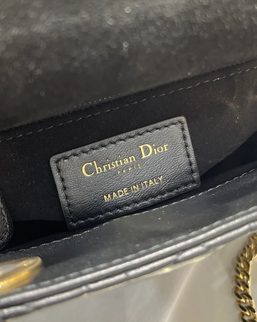Black Quilted Chain Top Handle Bag — interior label view