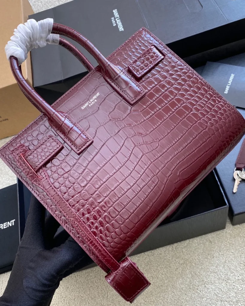 Burgundy Embossed Accordion Tote — angled rear view