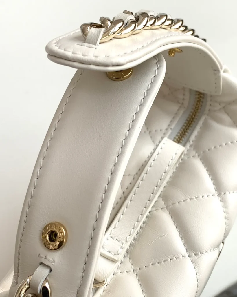 Ivory Quilted Round Chain-Edge Bag — fastener detail view