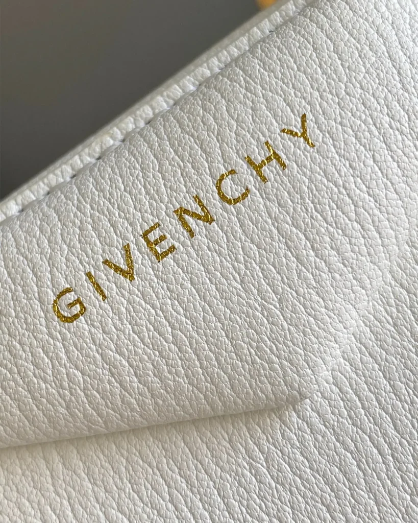 White Domed Top Handle Bag — logo detail view