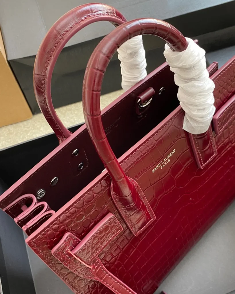 Burgundy Embossed Accordion Tote — top detail view