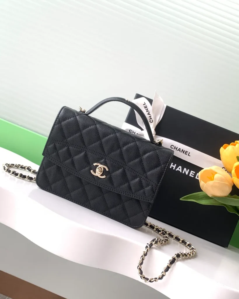 Black Quilted Top-Handle Chain Clutch — front view