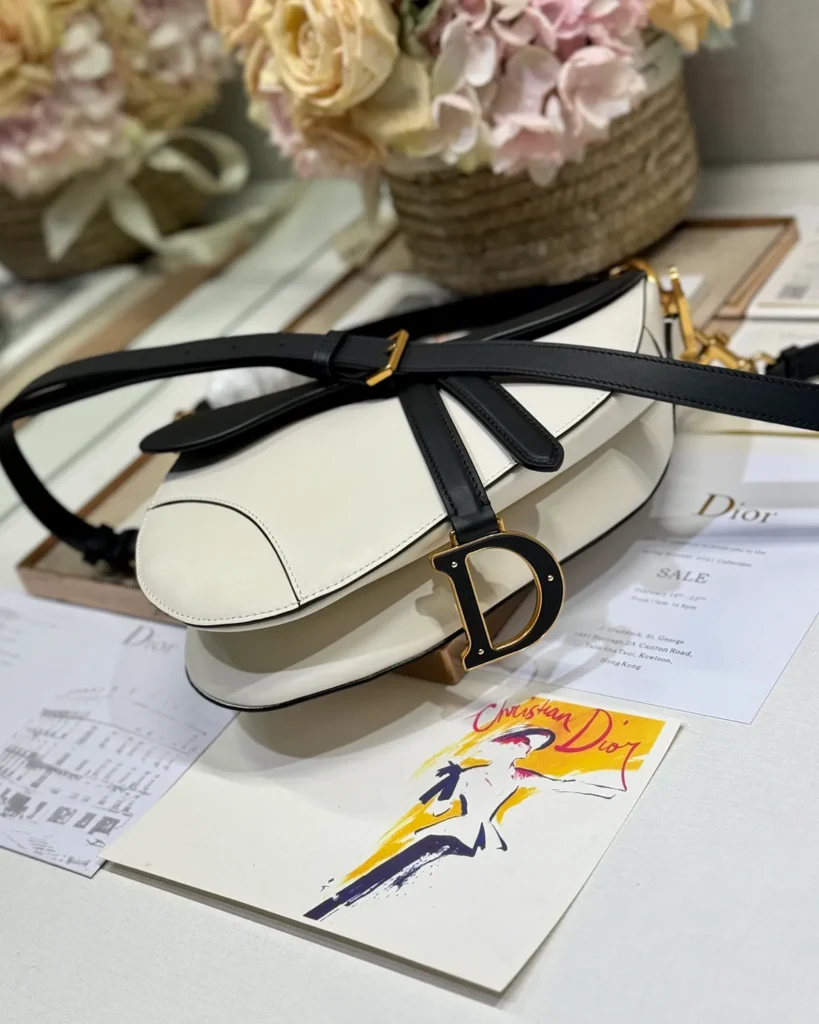 Cream and Black Asymmetric Saddle Bag — top view