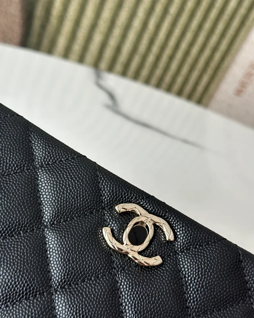 Black Quilted Metal-Handle Flap Bag — clasp detail view