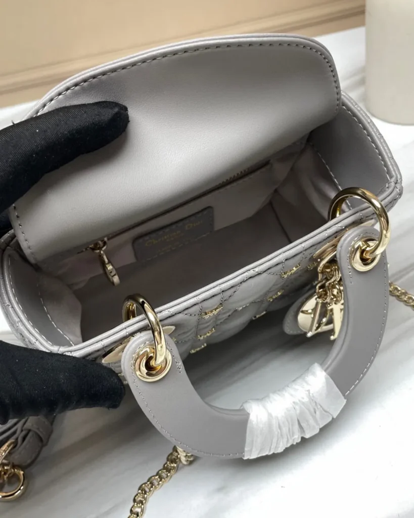Gray Butterfly Stud Quilted Top Handle Bag — interior view