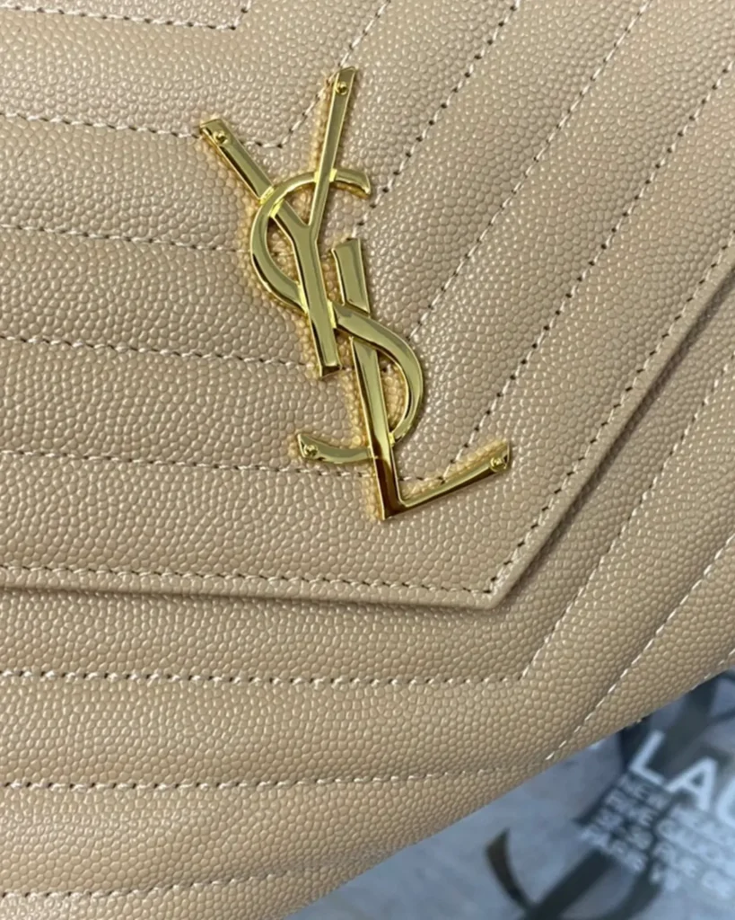Beige Chevron Envelope Chain Wallet — emblem view