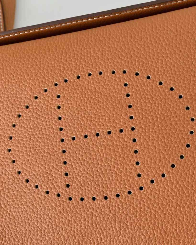 Videpoches-Inspired Tan Structured Crossbody Pouch, perforated motif close-up