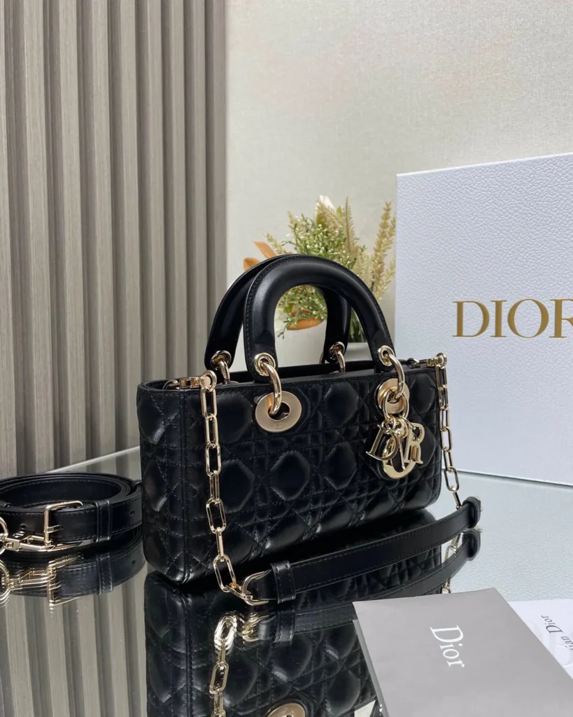 Black Quilted Chain Top Handle Bag — angled front view