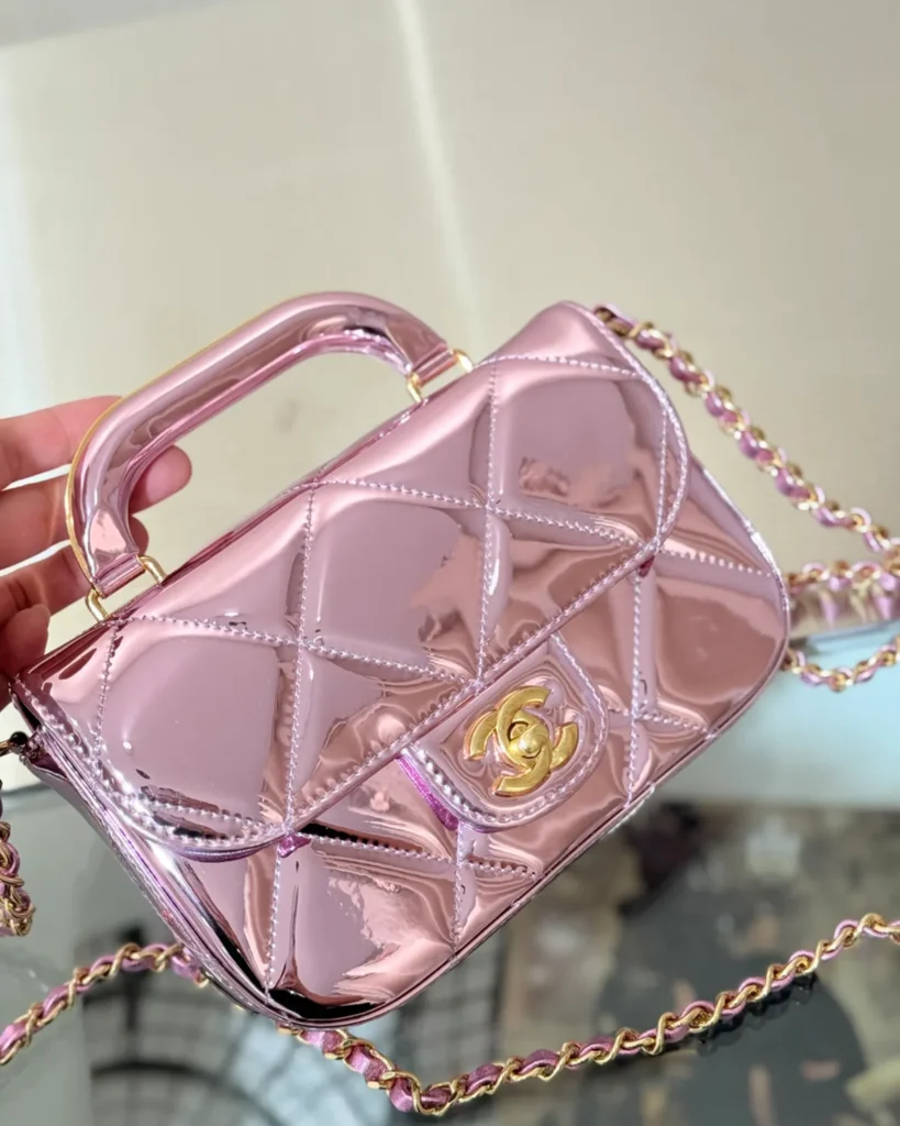 Metallic Pink Quilted Top-Handle Bag — angled front view