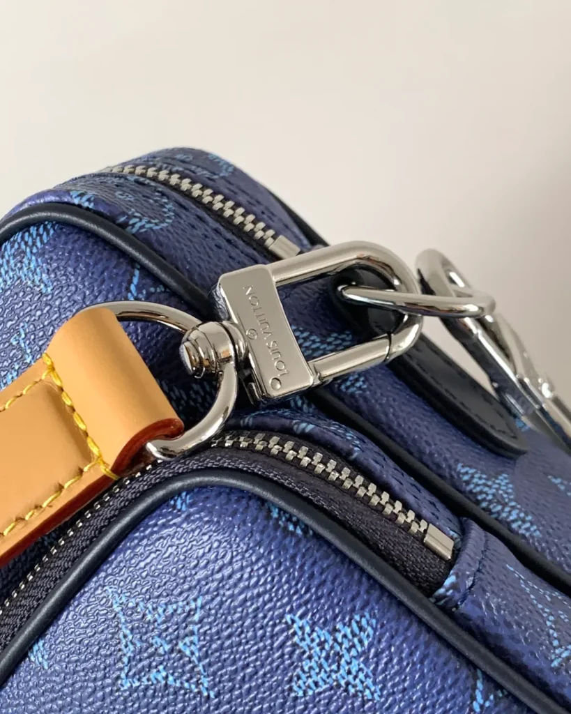Blue Monogram Dual Zip Camera Bag — strap clip view