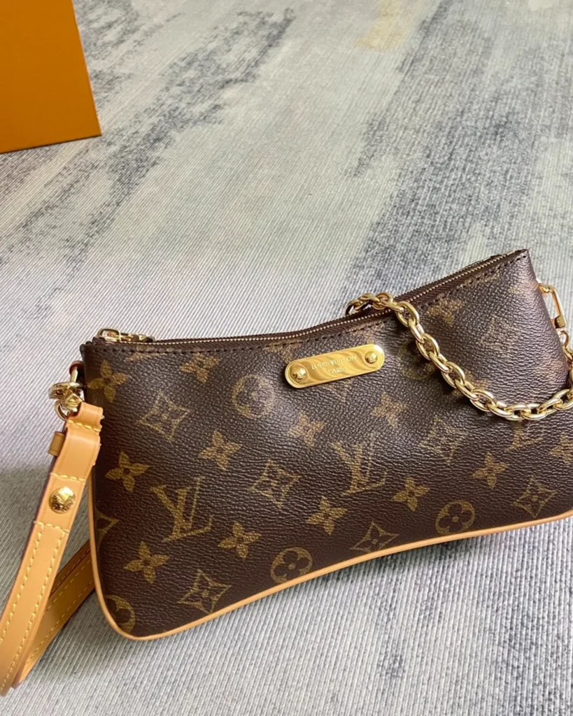 Brown Monogram Curved Zip Chain Pouch — three quarter view