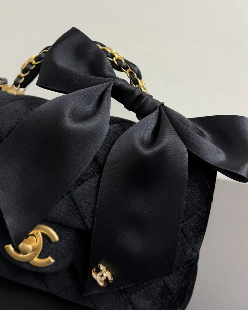 Black Bow-Detail Quilted Top-Handle Bag — bow detail view