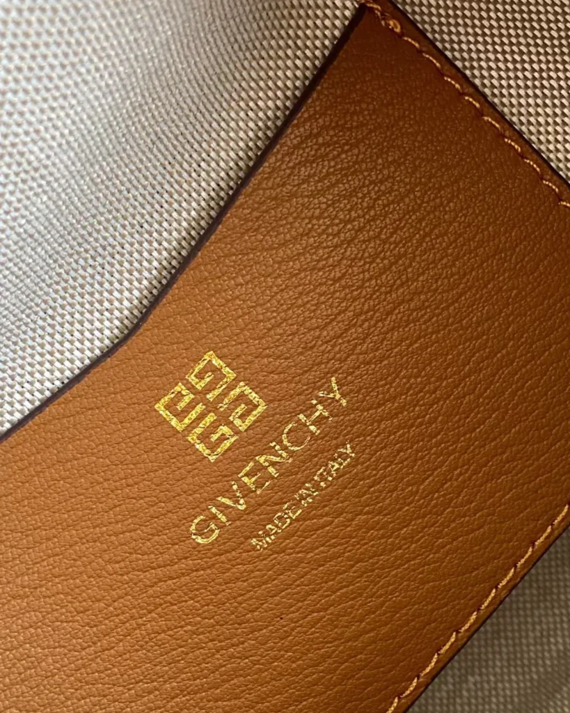 Tan Domed Top Handle Bag — interior label view