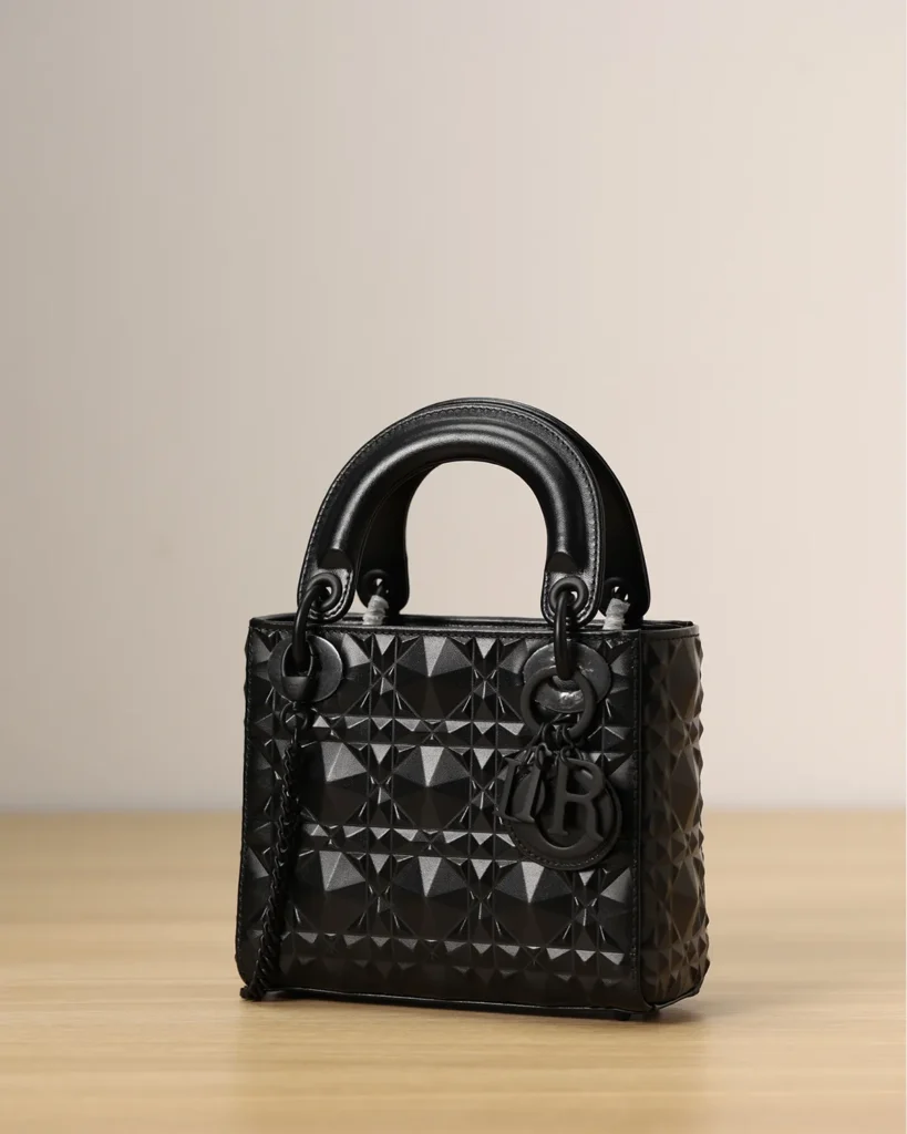 Black Faceted Top Handle Bag — angled front view