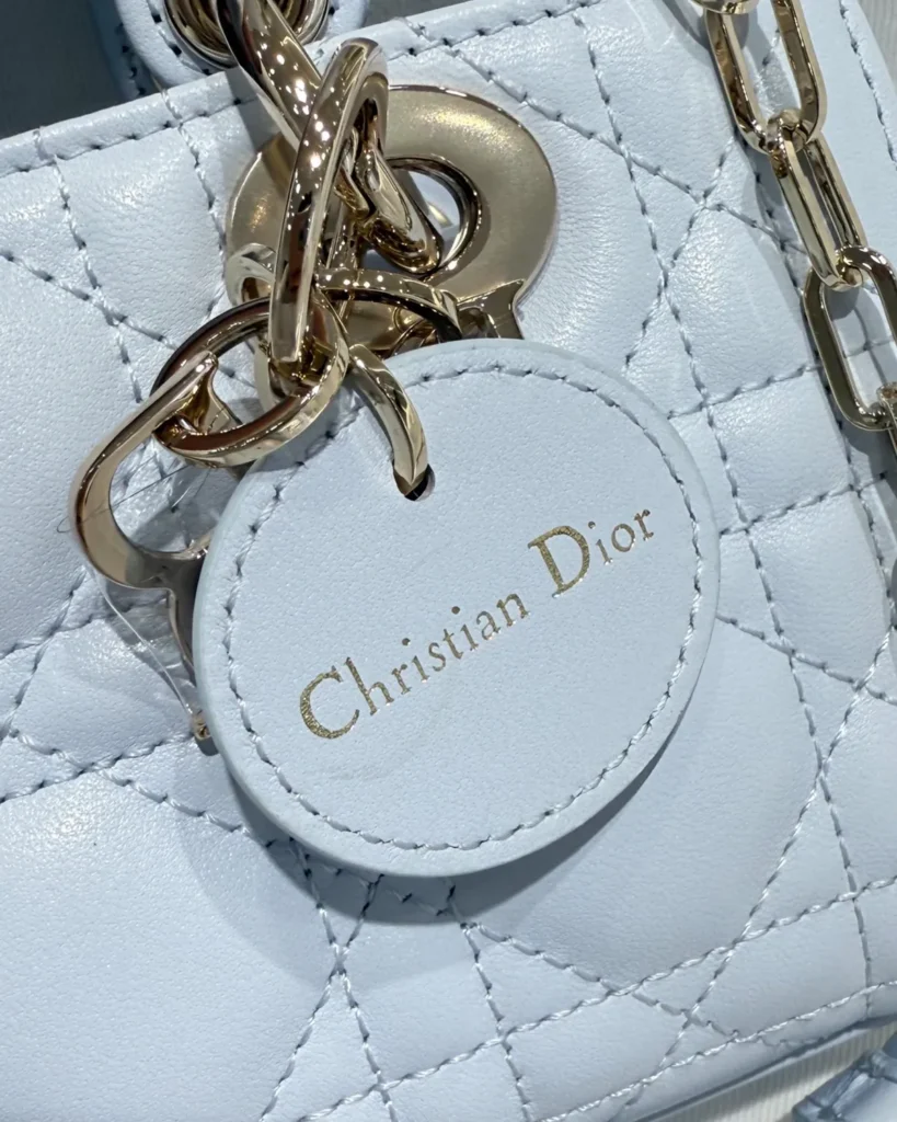 Soft Blue Quilted Chain Handbag — tag detail view